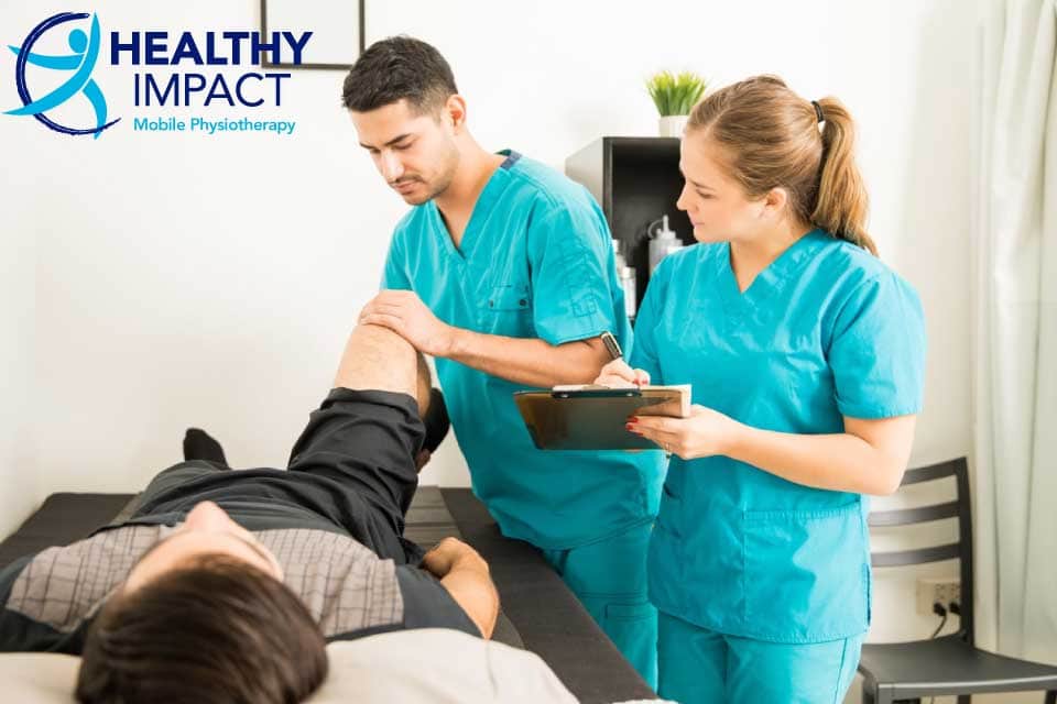 Medicare Funded Physiotherapy article image of a man receiving treatment by physiotherapists