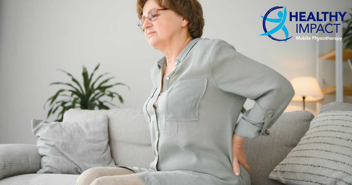 Low back pain article share image of a lady with back pain
