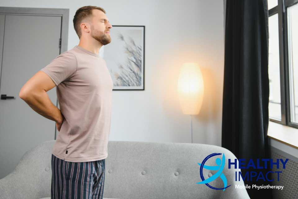 Low back pain article share image of a man with back pain