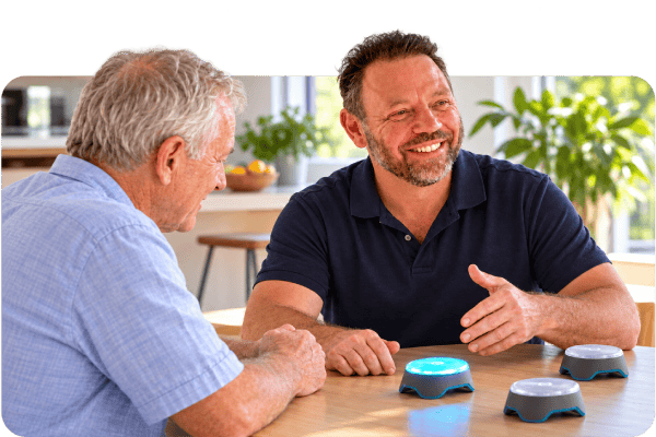Illustrative scene of Scott Baines explaining a BlazePods activity during a home physiotherapy appointment.