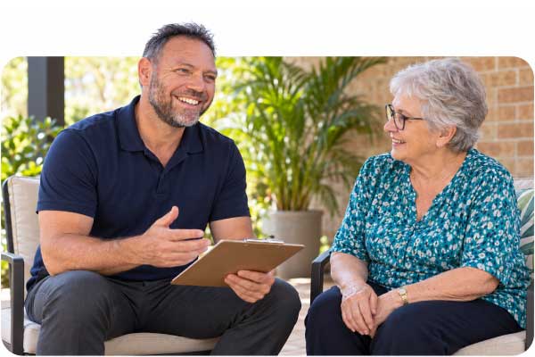 Scott Baines discussing balance and falls prevention goals with a patient.